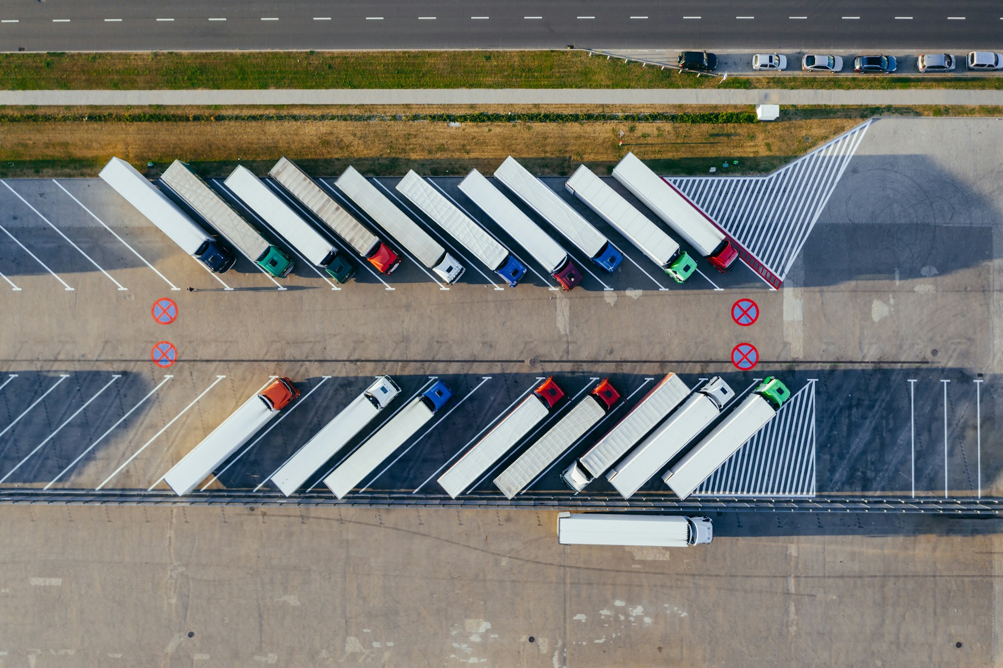 Trucks parked at a logistics terminal
